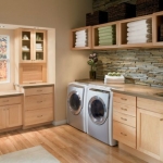 Beautiful-laundry-room-with-ample-storage-and-shelving-room